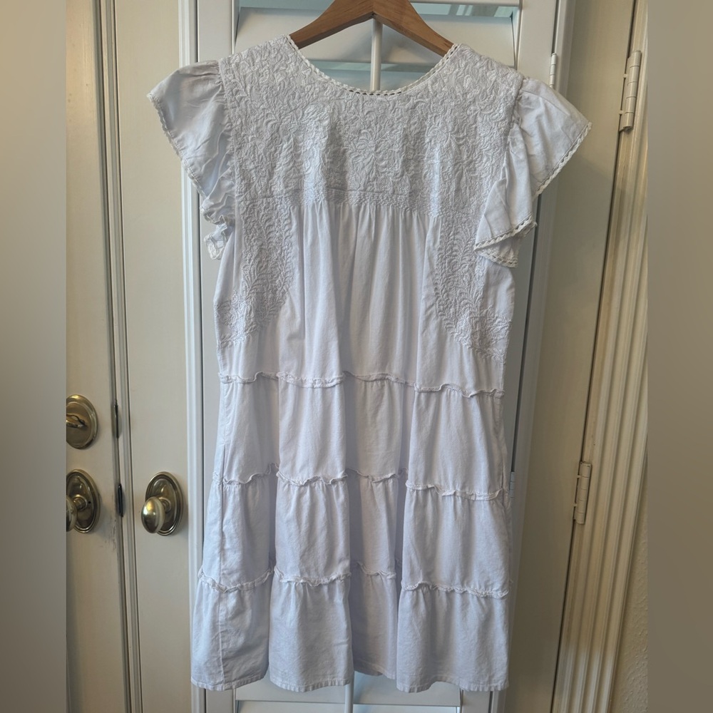 White Dress,  Embroidery throughout the chest.  Perfect for Tropical vacations